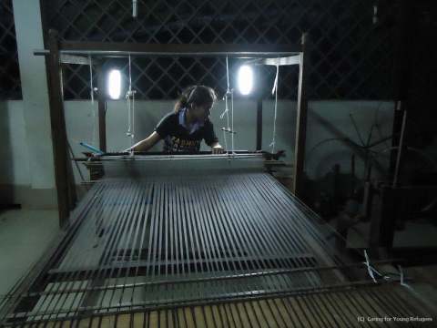 The Lights Helping to Weaving-work at Night in Textile Training Center (C)Caring for Young Refugees (Photo: Business Wire)