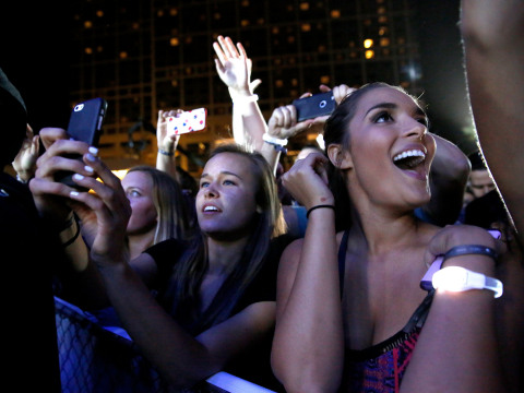 SAN DIEGO, CA - FEBRUARY 27: Jason Derulo and Hilton encourage music fans to 'Stop Clicking Around' and start playing with surprise concert outside of Hilton San Diego Bayfront on February 27, 2016 in San Diego, California. The concert celebrates the recently-launched 'Stop Clicking Around' marketing campaign and kicks off the 2016 Hilton Concert Series. Julia Cornwel (center) videos the concert. She attended with her friend Jessica Curtis. For more information, visit HHonors.com (Photo by Nancee E. Lewis/Getty Images for Hilton)