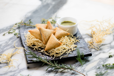 Crispy Impossible Samosas with mint chutney at Hotel ICON's GREEN (Photo: Business Wire)