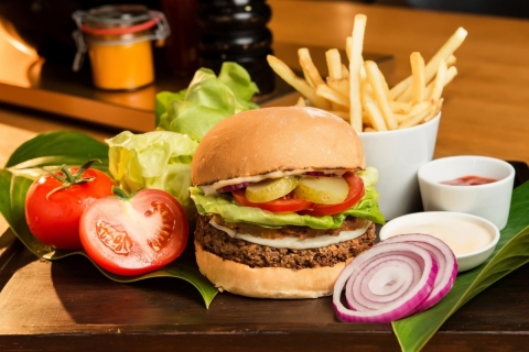 The Impossible Burger at Grand Hyatt Hong Kong, topped with veganaise, Daiya provolone, a sweet potato rustique, and herbs. (Photo: Business Wire)