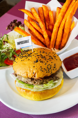 InterContinental Grand Stanford Hong Kong introduces the Impossible Indian Burger at Café on M, prepared on a turmeric bun topped with cheese, onion bhaji, cucumber yoghurt, and spicy pickles, served with sweet potato fries. (Photo: Business Wire)