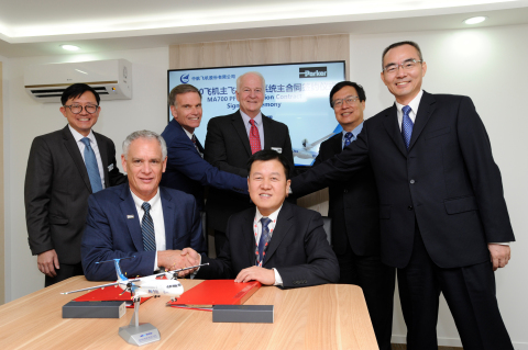 Parker Aerospace and AVIC executives sign the agreement for flight controls on the MA700 aircraft at Farnborough Air Show (Photo: Business Wire)