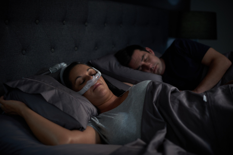 Woman sleeping on side with AirFit N30i nasal CPAP mask (Photo: Business Wire)