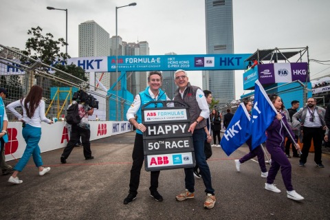 ABB CEO Ulrich Spiesshofer congratulates Alejandro Agag, chairman/ founder of the ABB FIA Formula E Championship, on the grid for the series’ 50th race, by presenting a specially commissioned pitboard to mark the occasion. (Photo: Business Wire)