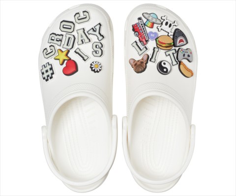 This year's limited edition #CrocDay Classic Clog will come fully loaded with a curated assortment of custom #CROCDAYISLIT Jibbitz™ charms — some of which glow! (Photo: Business Wire) 