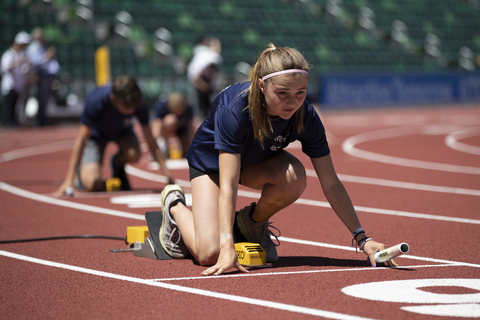 Young participants were guided through their preparations for a 4x100m relay race. (Photo: Business Wire)