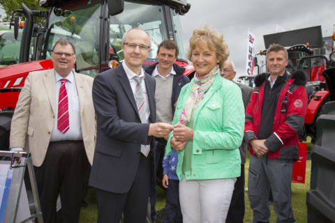 Laurent Pernin - Director, Sales MF, Europe & Turkey hands the keys of a MF 5610 Antarctica2 Special Edition tractor to winner Nancie Clanachan at the Royal Highland Show 2015. Left to right: Campbell Scott - Massey Ferguson Director Marketing Services, Laurent Pernin - Director, Sales MF, Europe & Turkey, Stuart Clanachan, Nancie Clanachan, Donald Clanachan, Simon Foster - Antarctica2 Creative Director and Audio-Visual Lead (Photo: Business Wire)