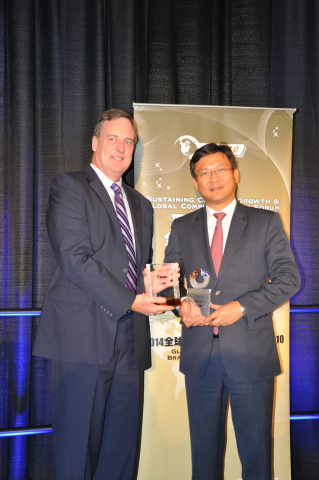 Lixin Cheng, chairman and CEO of ZTE USA receiving the 