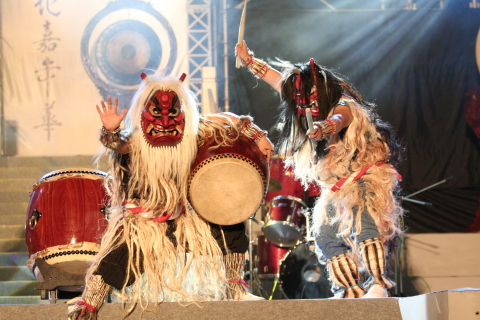 Enjoying folklore demons as they perform live to the beat of traditional drums 