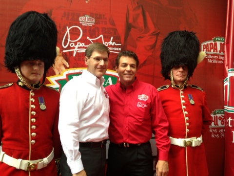 Papa John's founder, chairman, and CEO, John Schnatter, second from right, and Tony Thompson, Papa John's president and COO, celebrate the company reaching the 1,000 international restaurant milestone during a celebration in London. (Photo: Business Wire)