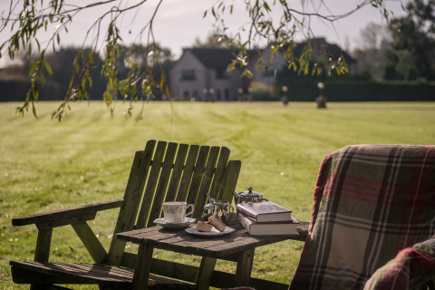 Taking tea on the lawn at the Millionaire Mansion, England. (Photo: Business Wire)