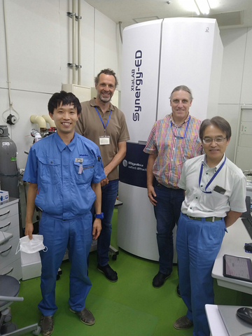 Eduardo C. Escudero-Adán and Jordi Benet-Buchholz from ICIQ (back left to right) during their visit to evaluate the XtaLAB Synergy-ED in Rigaku's Tokyo laboratory with Sho Ito and Akihito Yamano from Rigaku (front left to right). (Photo: Business Wire)
