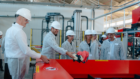 Roland Lescure, French Minister of Industry (left) accompanied by Emmanuel Ladent, CEO Carbios (far right) and representatives of Carbios partner brands (On, Salomon and Puma), inaugurates the textile preparation line for biorecycling. (Photo: Carbios)