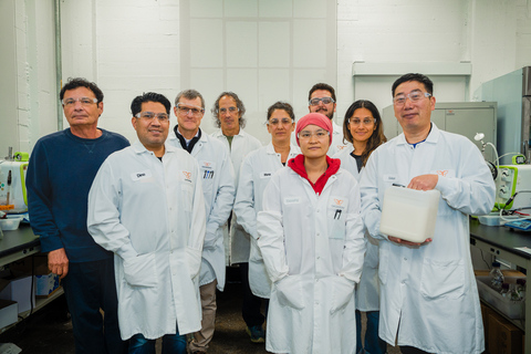 The Checkerspot team, poised in their lab, celebrating a landmark scientific achievement. (From left to right: Walter Rakitsky, Dino Athanasiadis, Leon Parker, Jon Wittenberg, Mona Correa, Xiaoying Zhou, Bryce Doherty, Veronica Benites, Xinhua Zhao; Not captured: Paul Derkach, Roberta Miller, Gawharah Alnozaili, Frederic Destaillats, Scott Franklin) Image: Shogo Kawatsu