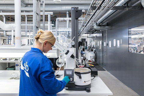 An SLB employee at work in one of the global technology company's production chemistry labs (Photo: Business Wire)