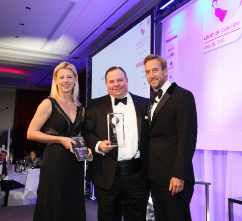 Michael Wheeler, executive vice president of NTT Communications Global IP Network at NTT America (center), receives the Global Carrier Awards from Ros Irving, Managing Director of Capacity Magazine, and Ben Fogle (Picture courtesy of Capacity Media).
