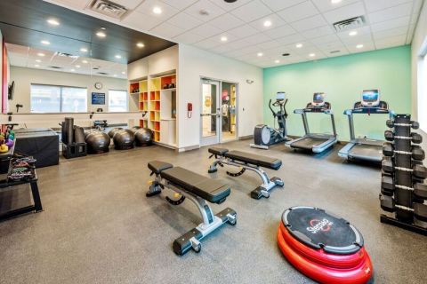 A fitness center that leverages the latest fitness trends through barre, TRX bands, free weights, cardio and flexibility gear, plus guests can get workout ideas from the fitness center tablet. (Photo: Business Wire)