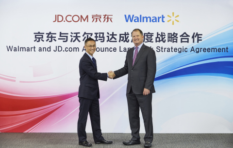 Neil Ashe, president and CEO of Walmart Global eCommerce, and Haoyu Shen, CEO of JD Mall, sign strategic alliance between their companies. (Photo: Business Wire) 